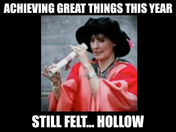 Enya, 2007, wearing academic robes, looking through a scroll