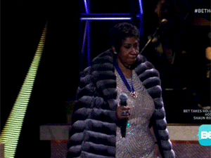 aretha-take-off-coat.gif