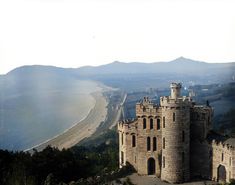 This is a colourised 1926 photo of Enya's castle, with the Irish Sea coastline and Wicklow Mountains in the background. 😍🏞️🏰